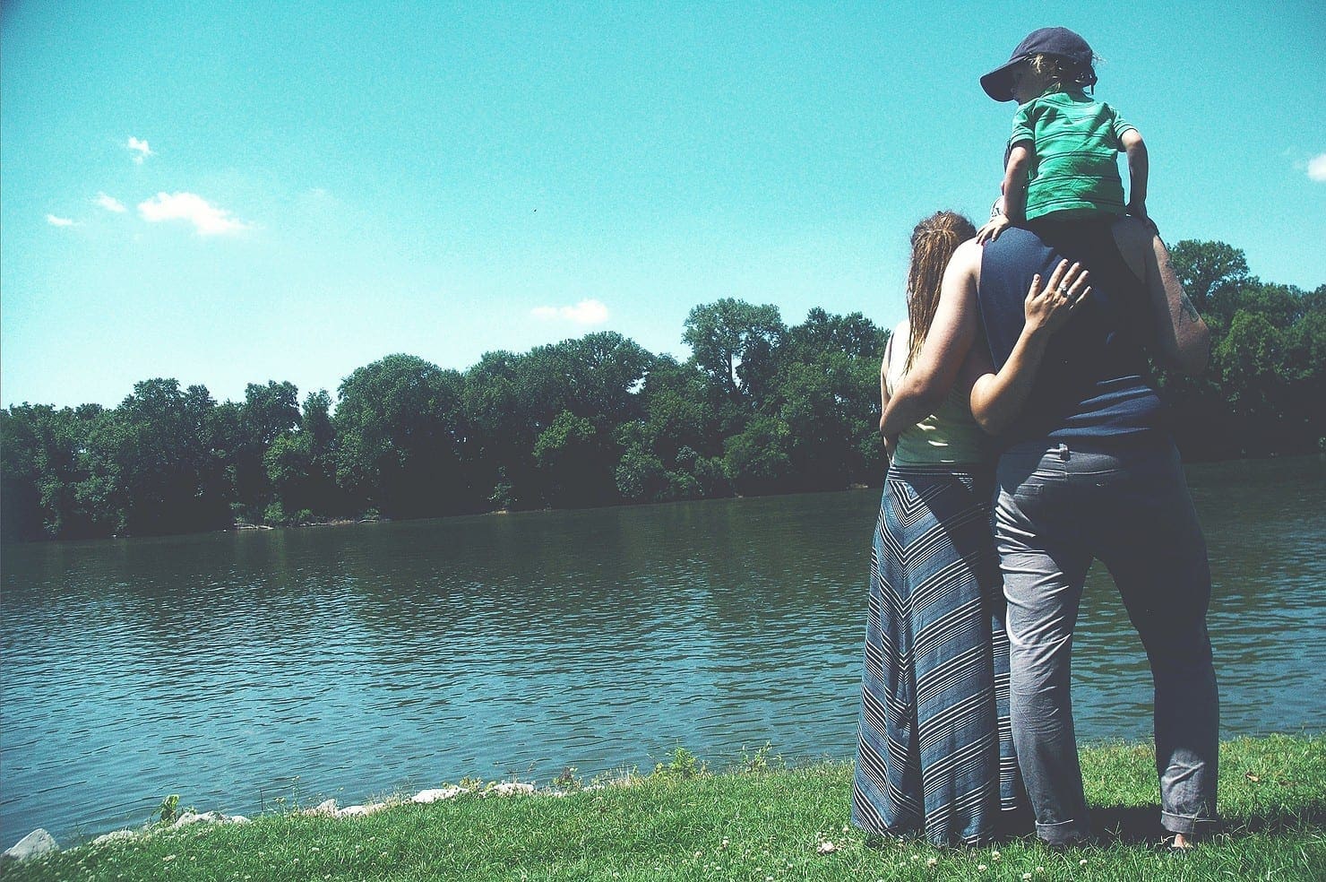 Family looking at a lake Family looking at a lake